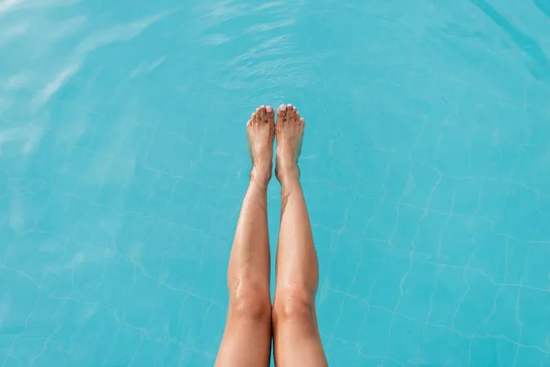 Pool with tanning ledge and umbrella holder