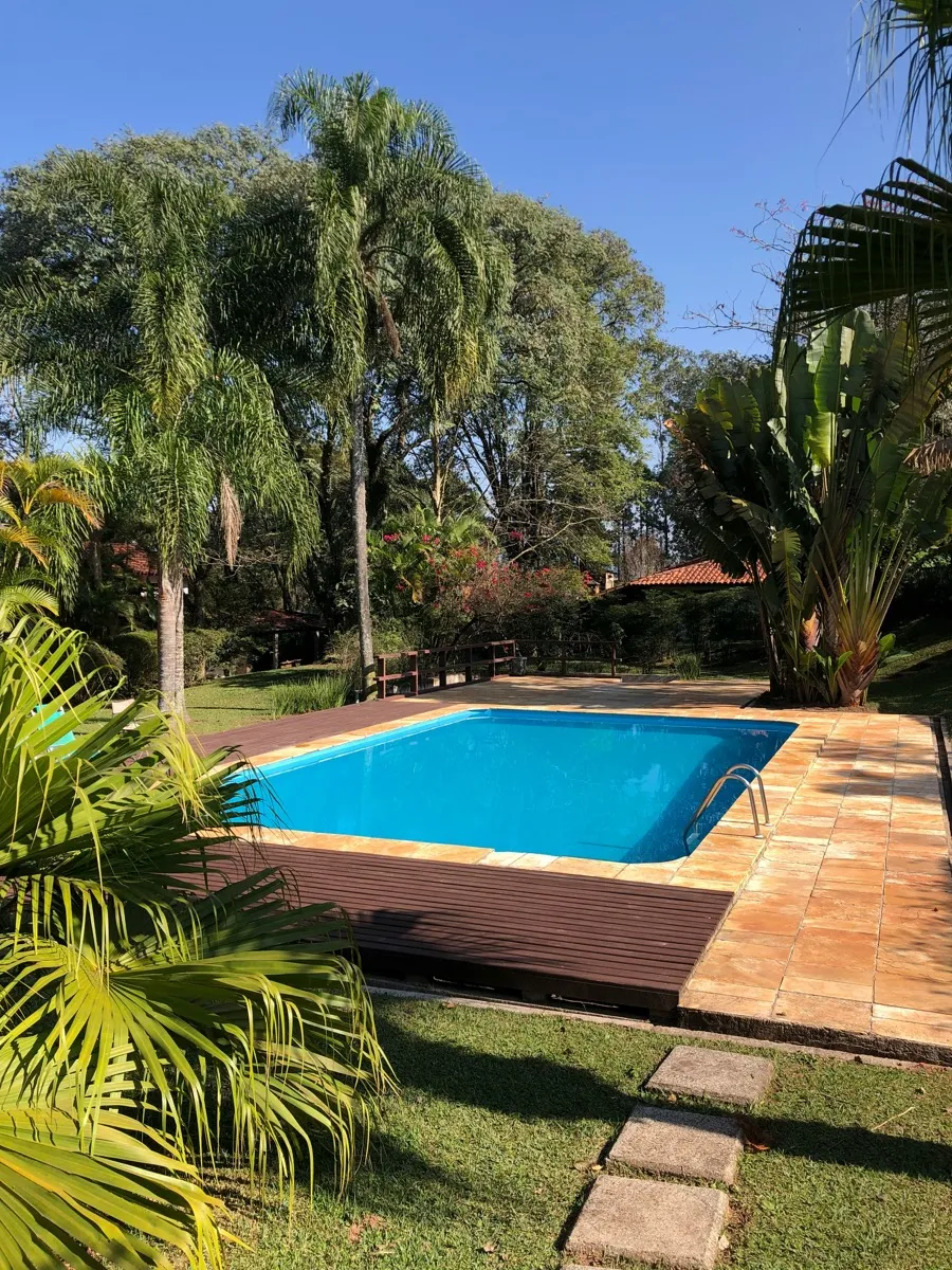 Completed pool with privacy fence and landscaping